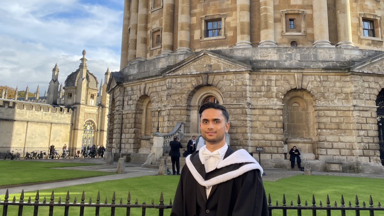 Ali Anis at graduation outside Radcliffe Camera
