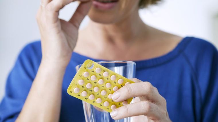 A woman taking her Hormone replacement therapy medication