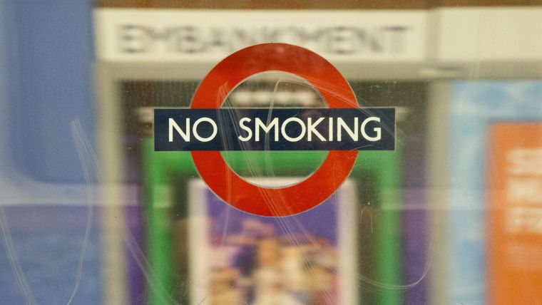 Photograph of a sign on the London Underground that says 'No Smoking'