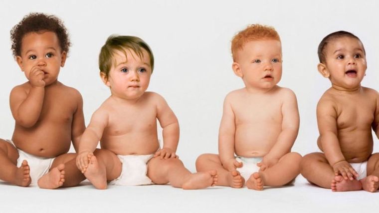 A row of babies sitting down