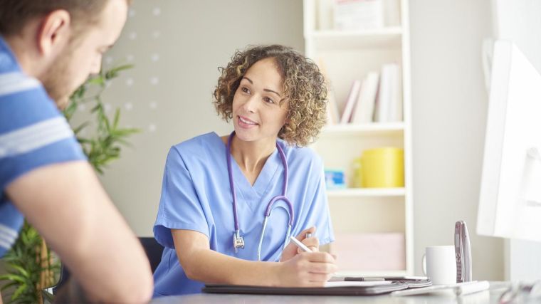 A female GP in a consultation with a female patient