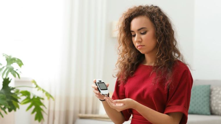 Image of woman with a digital monitoring device