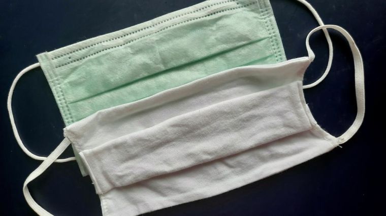 Different types of face covering - disposable and cotton.